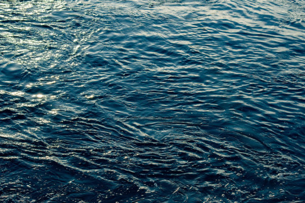 Blue and turquoise water with irregular wave structure