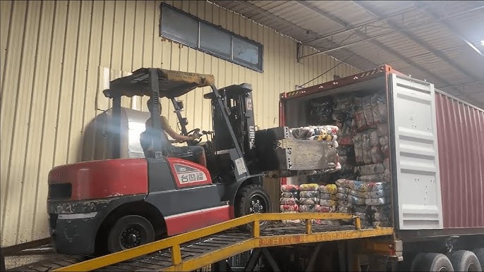 textile waste being loaded into shipping container