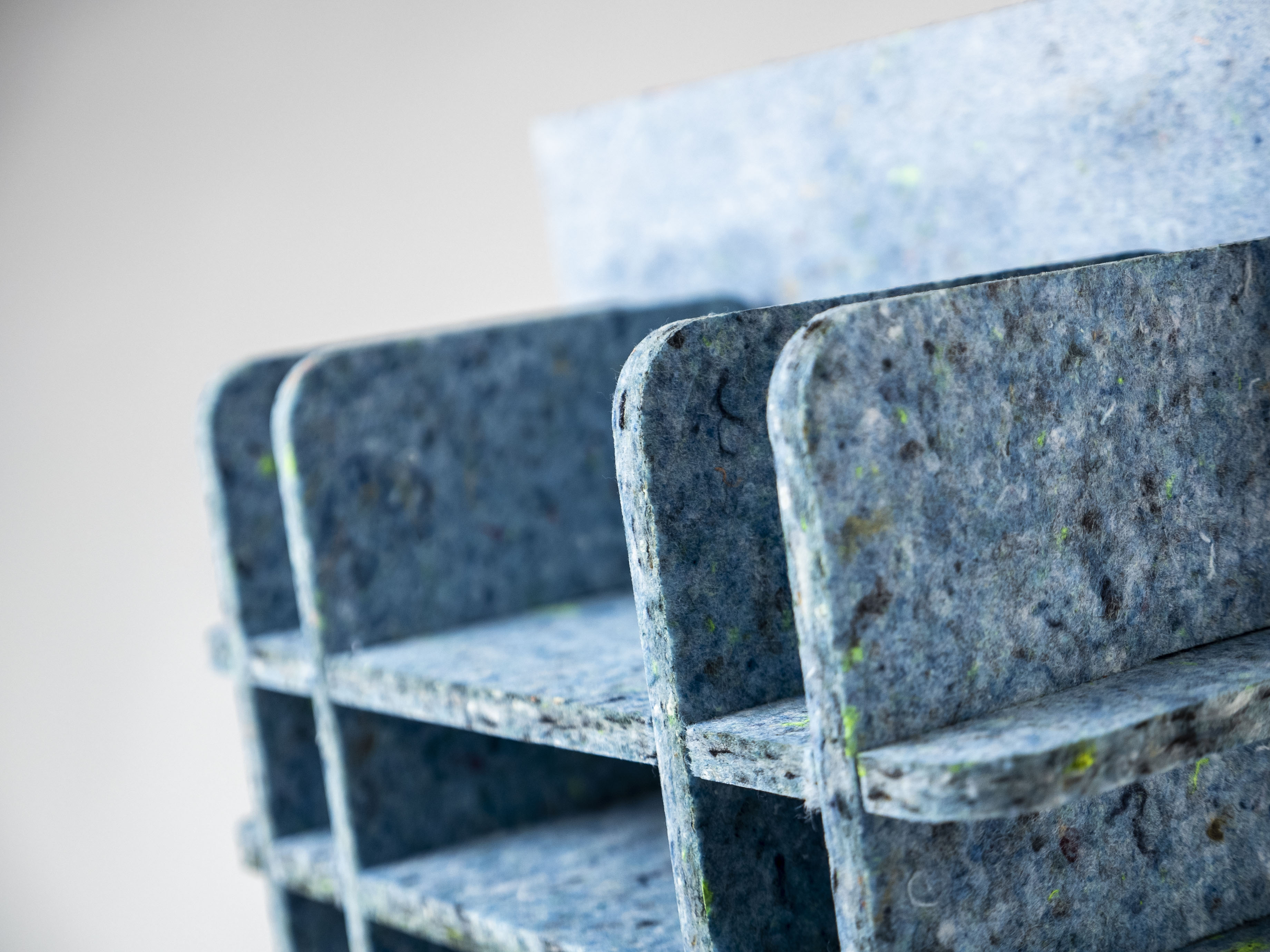 UPtex panels made from recycled denim and other textiles, built into a modular furniture feature piece